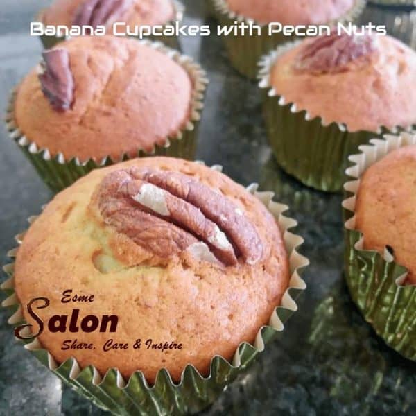 Banana Cupcakes and topped with a Pecan Nuts