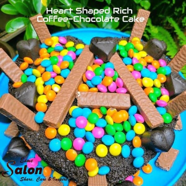 A Rich Coffee-Chocolate heart shaped cake decorated with colored chocolate andies