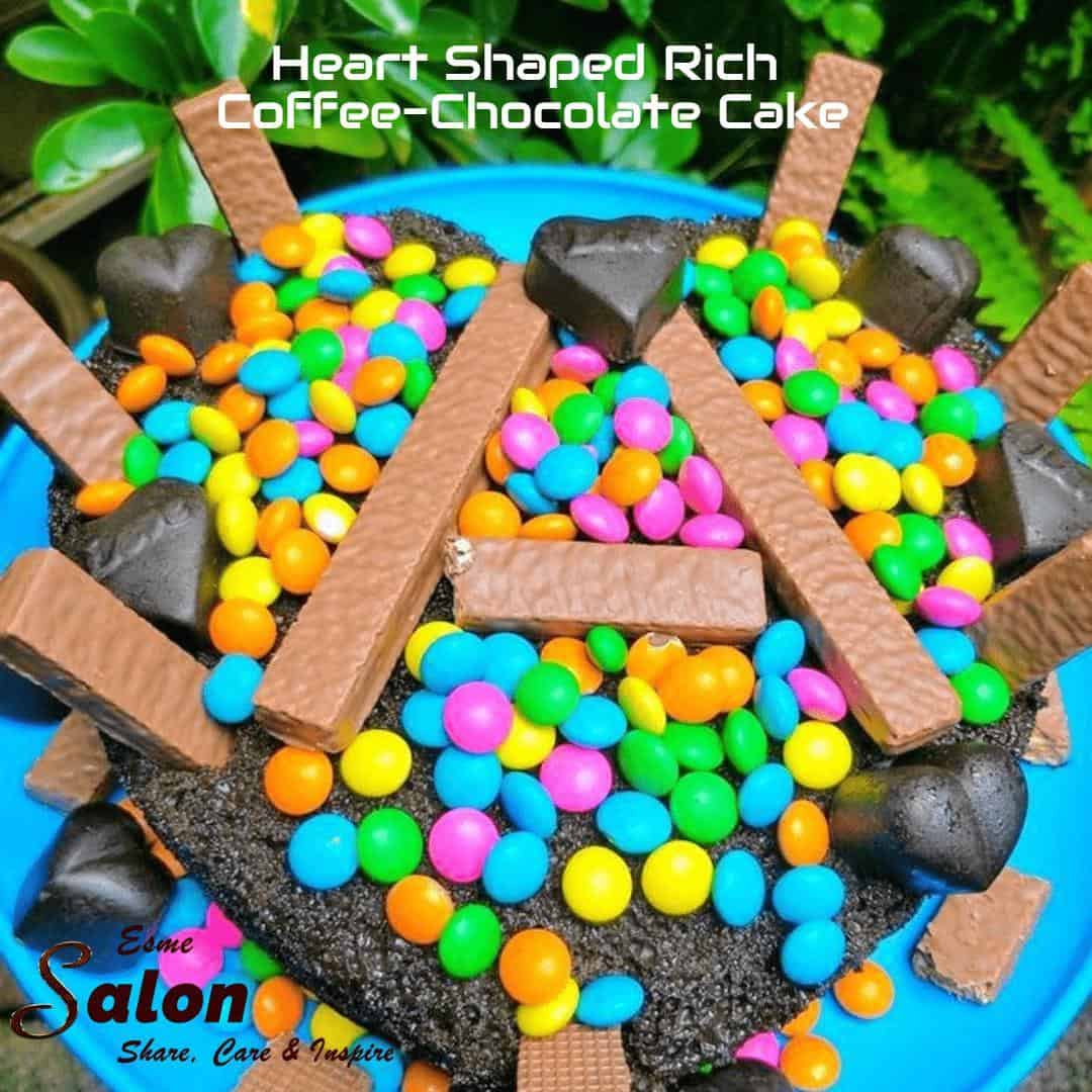 A Rich Coffee-Chocolate heart shaped cake decorated with colored chocolate andies