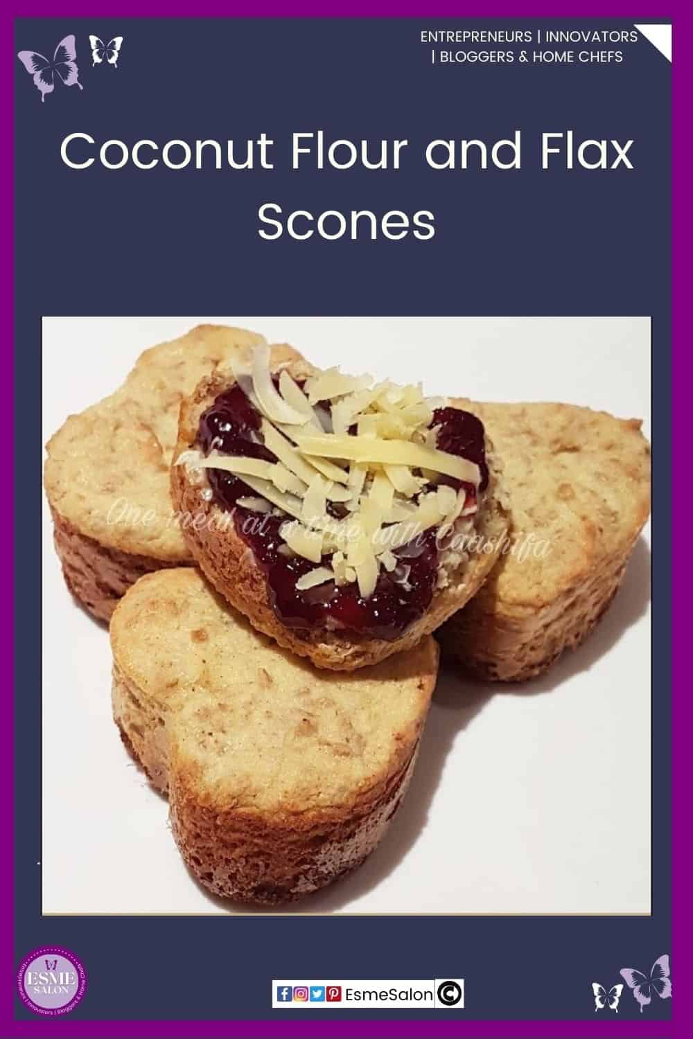 an image of 4 heart shaped Coconut Flour and Flax Scones with jam and shredded cheese