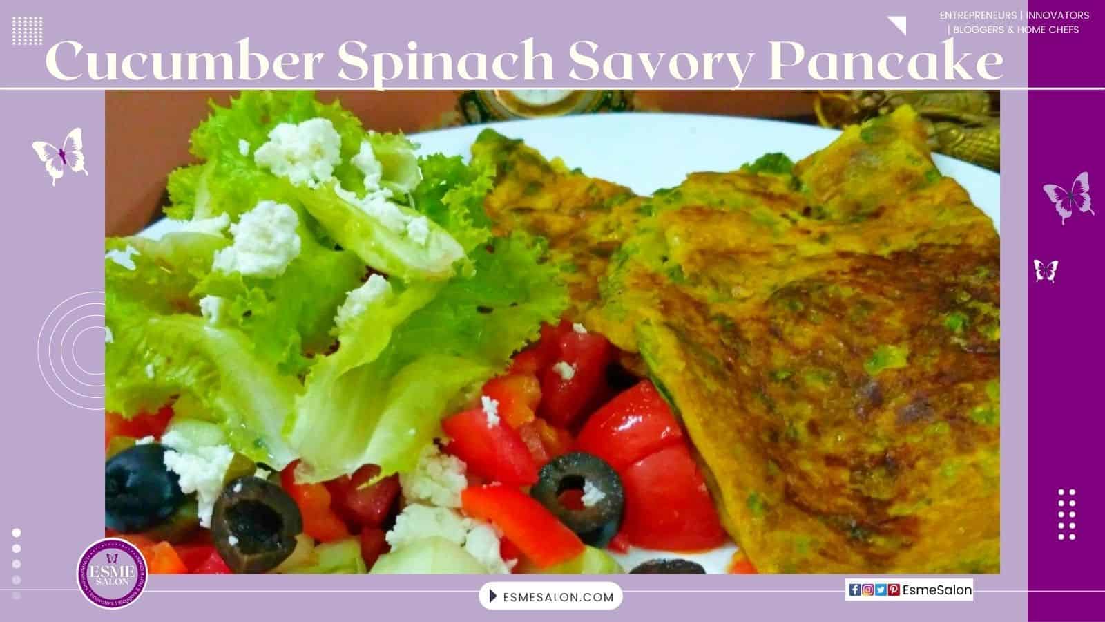 an imnage with Cucumber Spinach Savory Pancake plated with a Greek Salad on the side