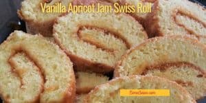 Vanilla Apricot Jam Swiss Roll slices on a glass serving plate