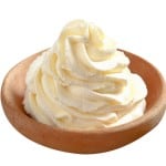 Wooden bowl with fresh cream
