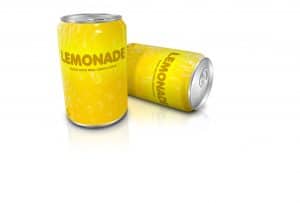Two yellow tins of fizzy lemonade