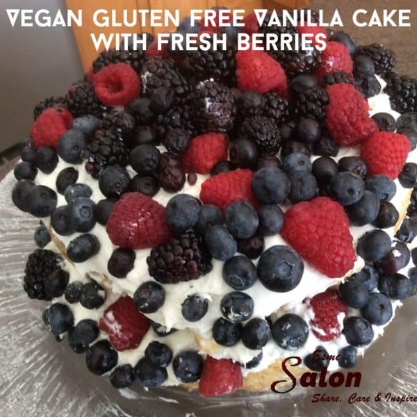 Two layer white vegan gluten free cake with fresh berries