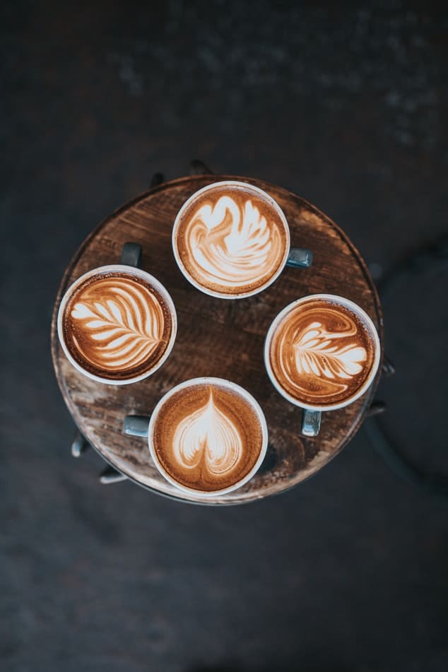 4 cups of coffee on a tray