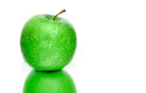 2 Green apples stacked on each other