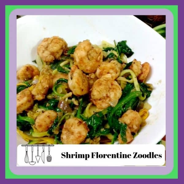 an image of Shrimp Florentine Zoodles on a bed of spinach