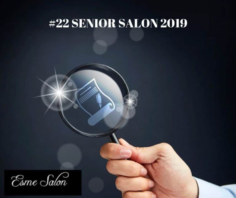 Hand holding magnifying glass with writing icon