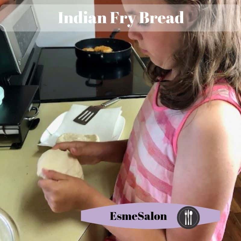 Stretching dough to prepare Indian Fry Bread