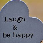 #33 Senior Salon 2019 Words Laugh & be happy on a gray heart shape stone