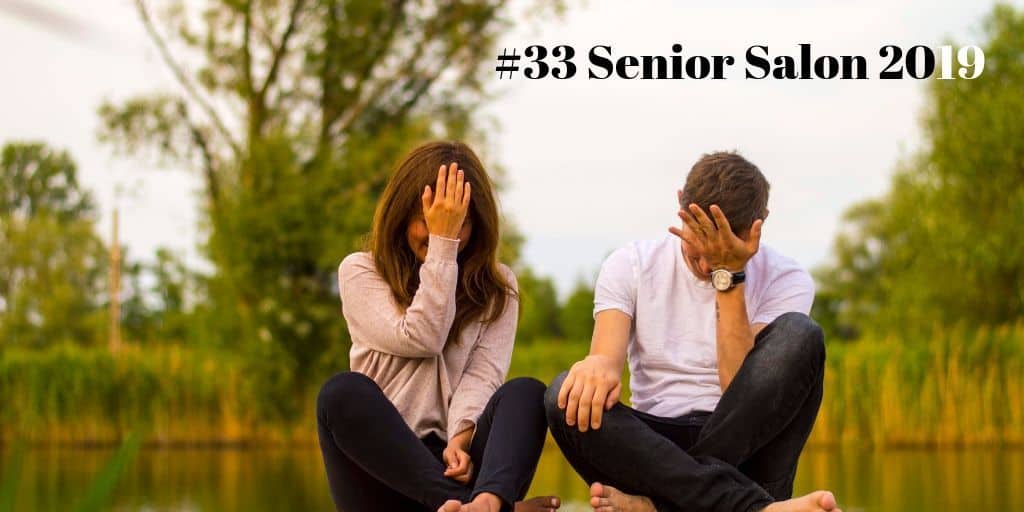 #33 Senior Salon 2019 Man and Woman Holding Forehead Sitting on Bridge