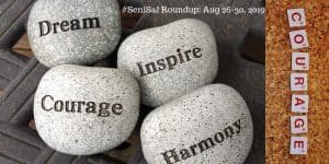 4 Grey stones with words written on each: Dream, Courage, Inspire, Harmony