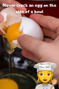 How to properly crack an egg, to prevent little bits of shell in the egg