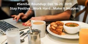 A woman working on a laptop with eating lunch