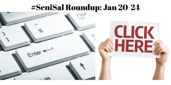 white keyboard with a white sign held up high stating click here