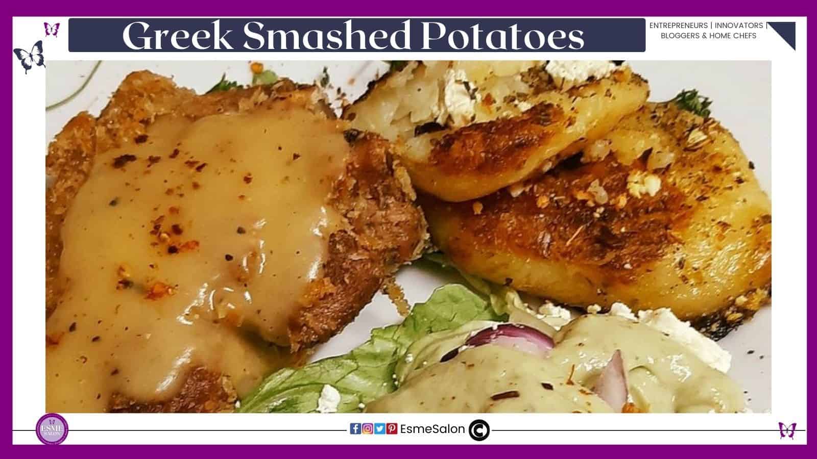 an image of an image of Greek Smashed Potatoes with pork chops, and a side of salad