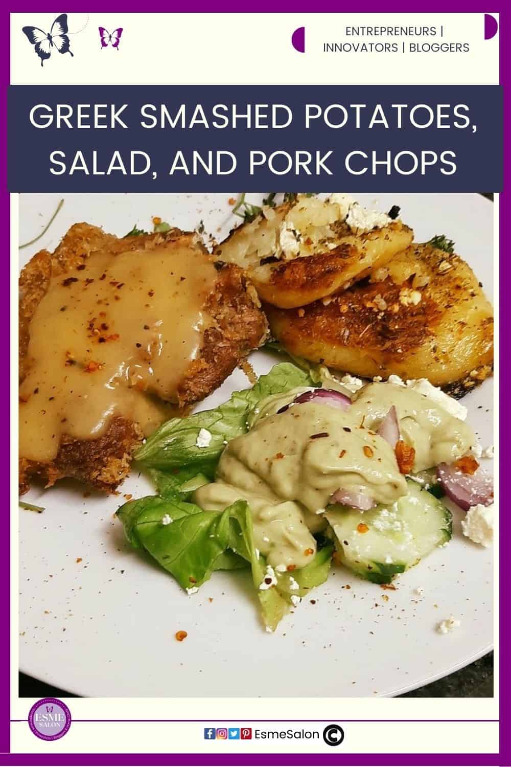 an image of Greek Smashed Potatoes with pork chops, and a side of salad