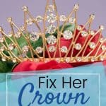 Diamond crown sitting on bed of red roses