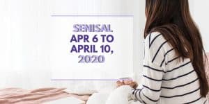 lady with long black hair, white and black striped jersey sitting on her bed
