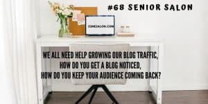 white desk with pastel flowers and a brown cork board and laptop