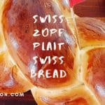 Zopf plait Swiss Bread with Swedish flag on a wooden pin stuck in the bread