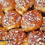 Caramel cinnamon pecan buns with lots of pecans on a sticky topping