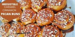Caramel cinnamon pecan buns with lots of pecans on a sticky topping