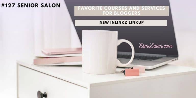 white bed pedestal, white coffee mug, pink phone and open laptop