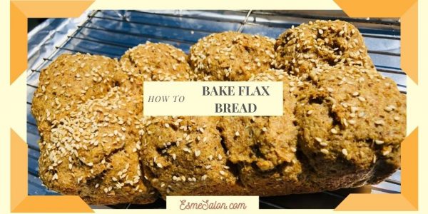 ground golden flax seed meal bread topped with sesame seeds