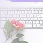 white keyboard with a dusty pin rose