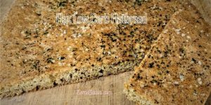 Sliced flax flatbread topped with sesame and poppy seeds