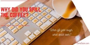 keyboard with spilled coffee on the keys and brown desk