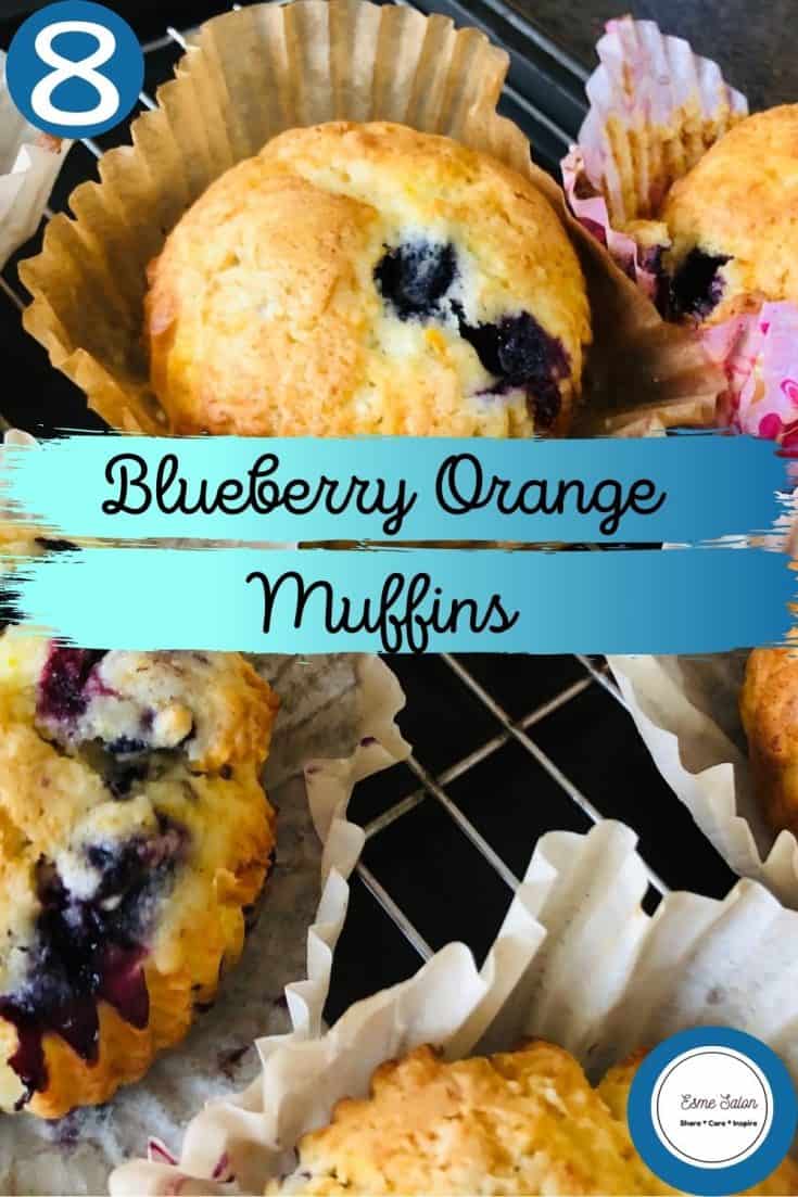 Blueberry Orange Muffins in paper cupcake holders on cooling rack