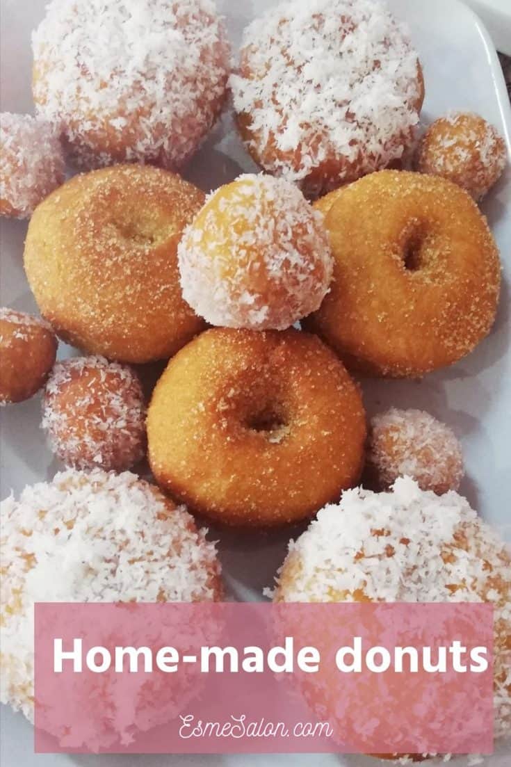 Donuts covered with coconut and some with sugar