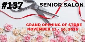 pink and cream roses and a scissor cutting a red ribbon