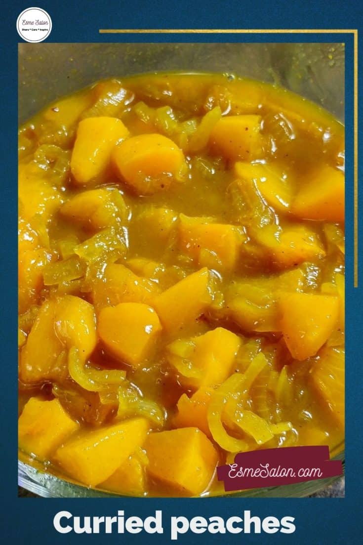 Curried peaches with onions and curry sauce in a glass bowl