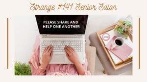 Lady in lin with laptop on her lap with tray, with pink book and white mug of coffee