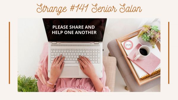 Lady in lin with laptop on her lap with tray, with pink book and white mug of coffee