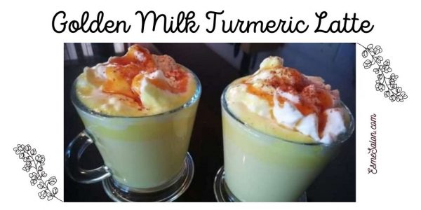 Golden Milk Turmeric Latte in a glass mug with fresh cream and a sprinkling of cinnamon.