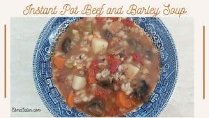 Beef and Barley Soup with carrots, potatoes in a blue bowl