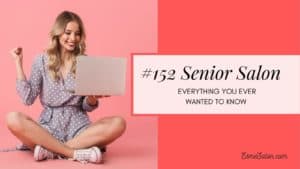 Lady sitting crossed leg and holding a laptop in her left hand