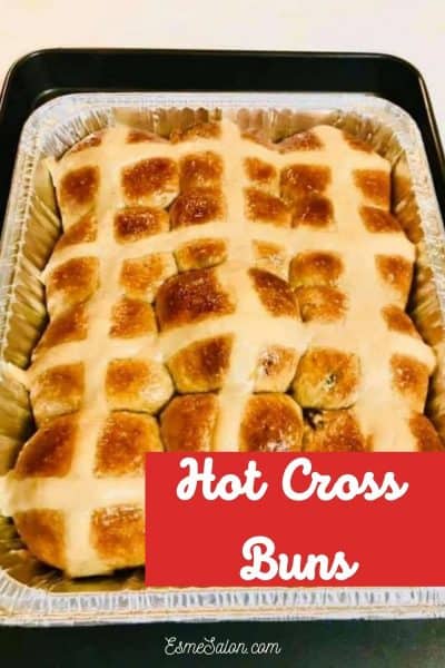Hot cross buns with a white cross in a tinfoil container