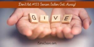 Two hands holding the scrabble cubes spelling GIVE