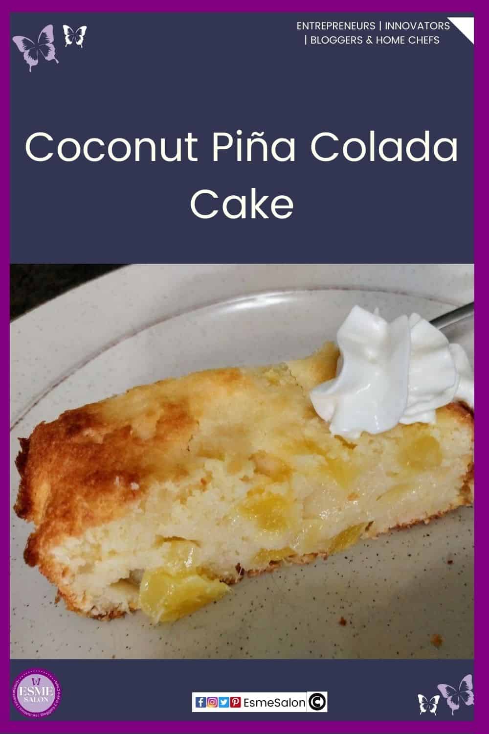 an image of a slice of Coconut Piña Colada Cake oozing with pineapple and a dollop of cream on a white sideplate