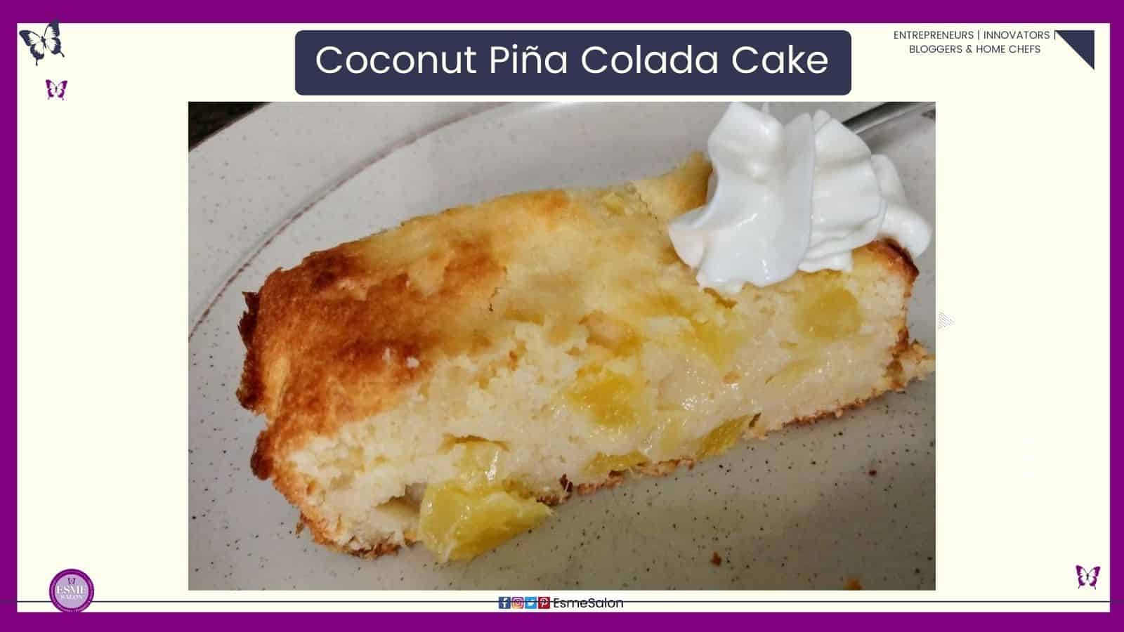 an image of a slice of Coconut Piña Colada Cake oozing with pineapple and a dollop of cream on a white side plate