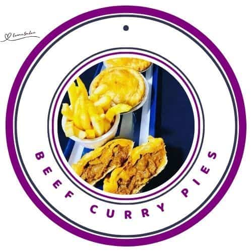 an image of Beef Curry Pies cut and whole with a side of fries