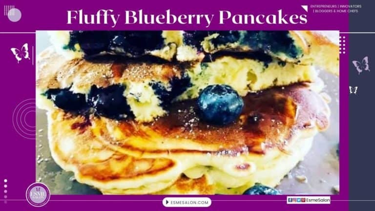 An image of a platter stacked with Blueberry Pancakes and fresh berries on the side