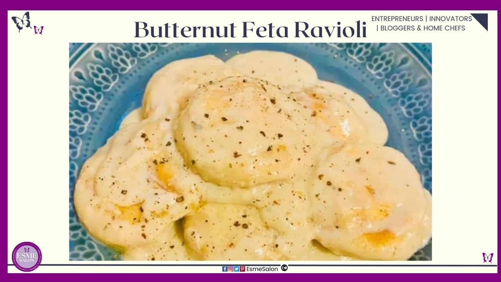 an image of a blue dinner plate filled with Butternut Feta Ravioli served with a brown butter cream sauce