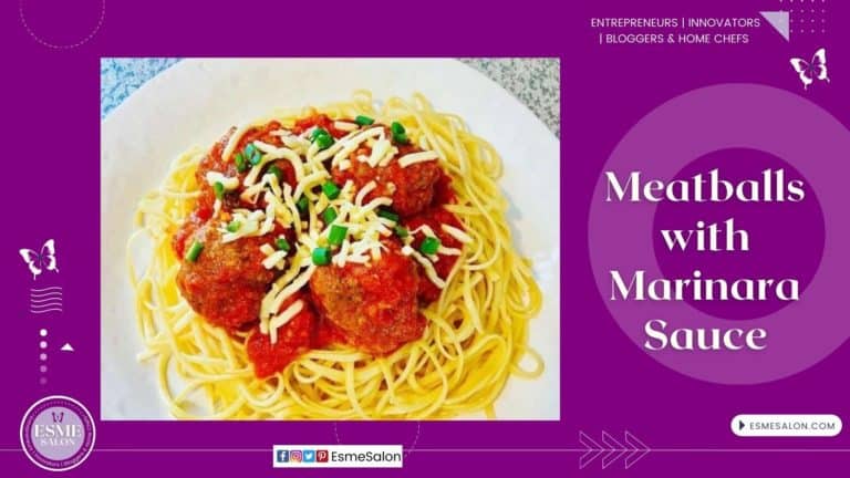 An image of a plate of pasta topped with meatballs and marinara sauce